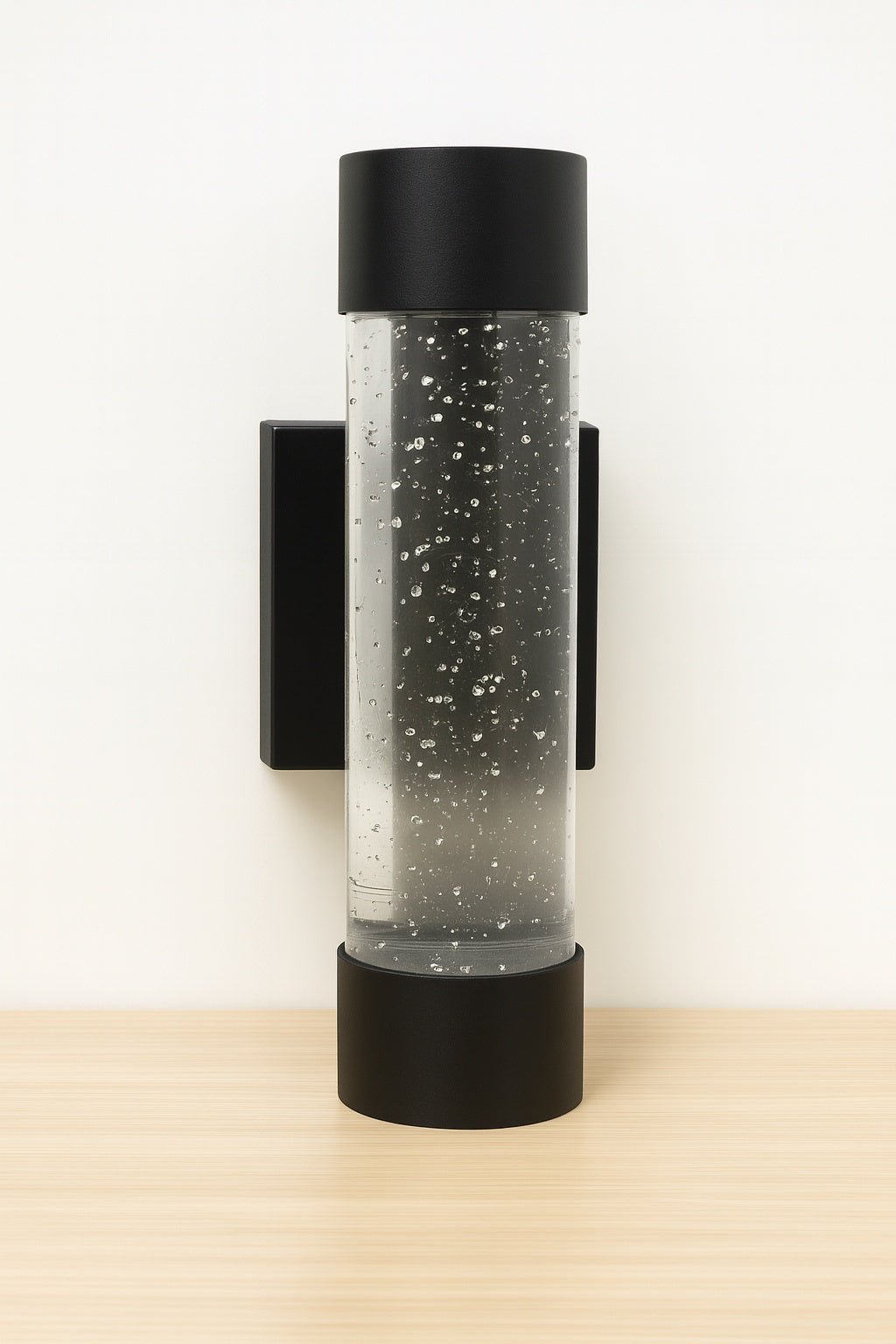 Home Decorators Collection Ansel 11 3 in Black Modern Bubble Glass Integrated LED Hardwired Garage and Porch Exterior Wall Light Cylinder Sconce